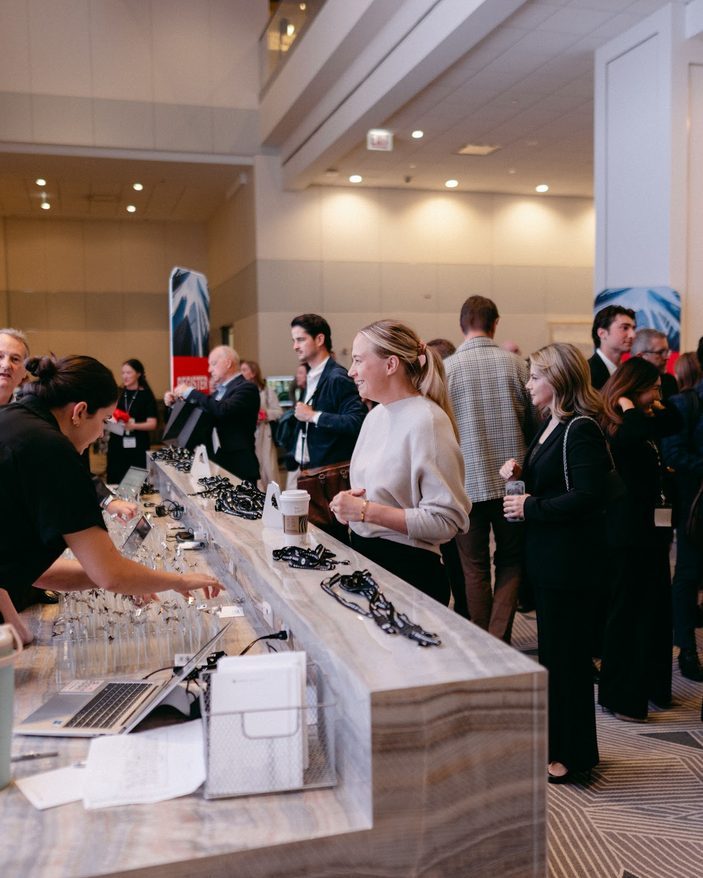 Guests gathering in the lobby before the program